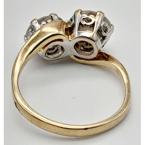 56 - Fabulous 9 CARAT GOLD RING. Crossover style with 2 x large beautifully cut SEARCHLIGHT ZIRCONIAS. 2.... 