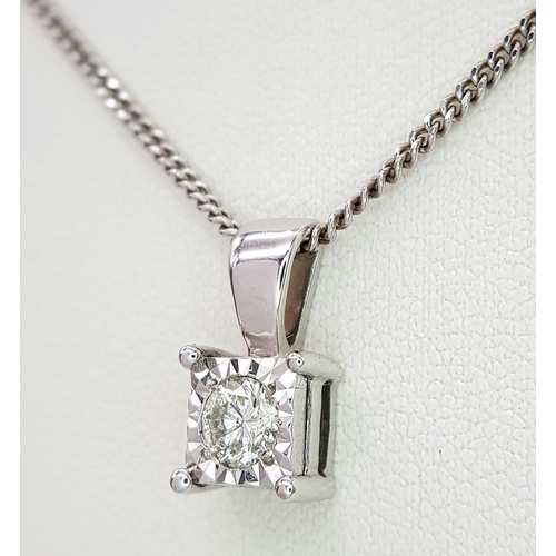 68 - AN 18K WHITE GOLD DIAMOND SOLITAIRE PENDANT ON AN 18