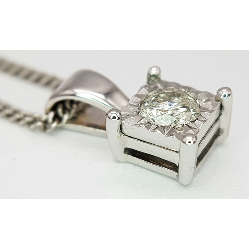 68 - AN 18K WHITE GOLD DIAMOND SOLITAIRE PENDANT ON AN 18