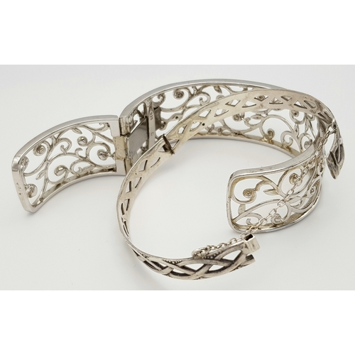 1086 - Two Stylish Solid Silver 925 Bangles, Foliate Design Hinged Torque and Safety Chain, Total weight: 5... 