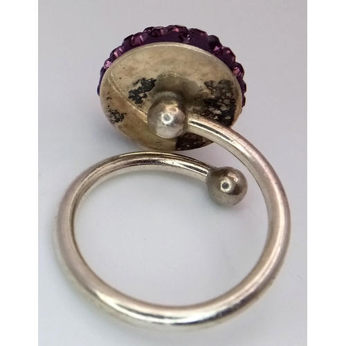 1210 - A Sterling Silver Purple Crystal Set Ring Size M. The Crown Measures 1.5cm Diameter. Gross Weight 4.... 