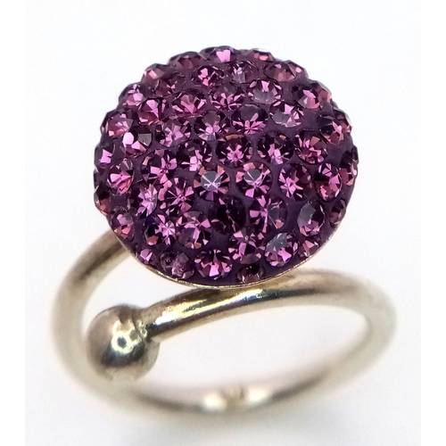 1210 - A Sterling Silver Purple Crystal Set Ring Size M. The Crown Measures 1.5cm Diameter. Gross Weight 4.... 