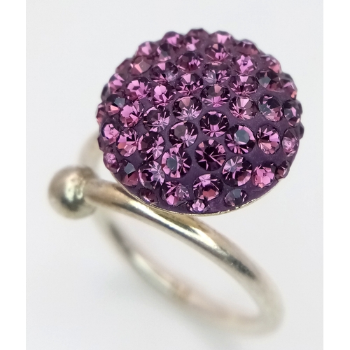 1210 - A Sterling Silver Purple Crystal Set Ring Size M. The Crown Measures 1.5cm Diameter. Gross Weight 4.... 