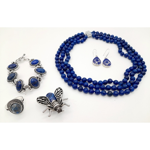 1558 - A Lapis Lazuli jewellery suite comprising a three-row necklace, a bracelet, a pair of 925 silver dro... 