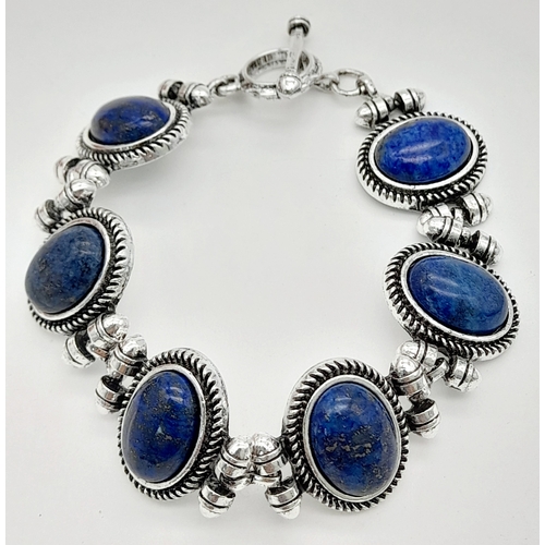 1558 - A Lapis Lazuli jewellery suite comprising a three-row necklace, a bracelet, a pair of 925 silver dro... 