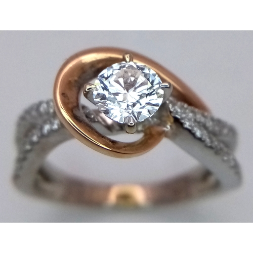 16 - An 18K White and Yellow Gold Diamond GIA Certified Ring. A central 0.52ct brilliant round cut diamon... 