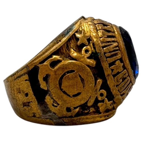 1330 - A Vietnam war era US Coast Guard fraternity Ring, featuring a central dark blue oval stone and a sta... 