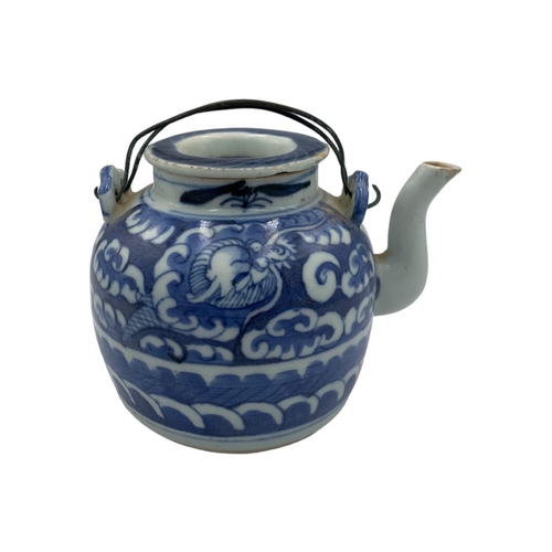 1344 - An antique Chinese Ming dynasty blue and white porcelain teapot - featuring a dragon hiding amongst ... 