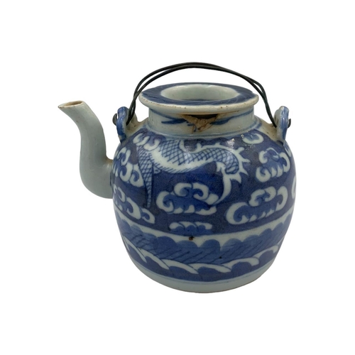 1344 - An antique Chinese Ming dynasty blue and white porcelain teapot - featuring a dragon hiding amongst ... 