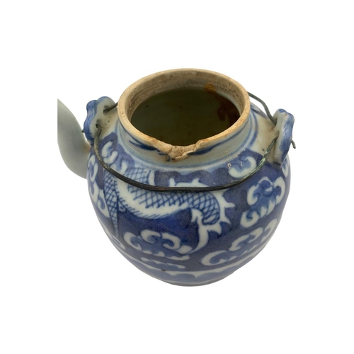 1344 - An antique Chinese Ming dynasty blue and white porcelain teapot - featuring a dragon hiding amongst ... 