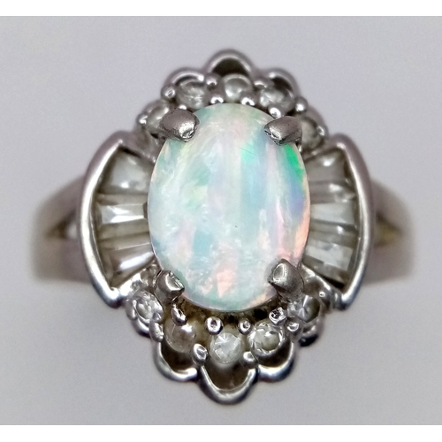 1147 - A Vintage Opal and Clear Stone, Art Deco Design, Ring Size P. The Ring measures 1.6cm Long at the cr... 