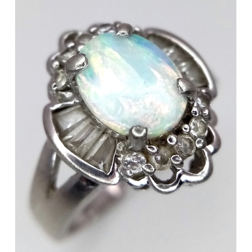 1147 - A Vintage Opal and Clear Stone, Art Deco Design, Ring Size P. The Ring measures 1.6cm Long at the cr... 