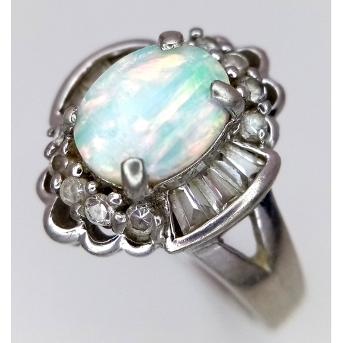 1147 - A Vintage Opal and Clear Stone, Art Deco Design, Ring Size P. The Ring measures 1.6cm Long at the cr... 