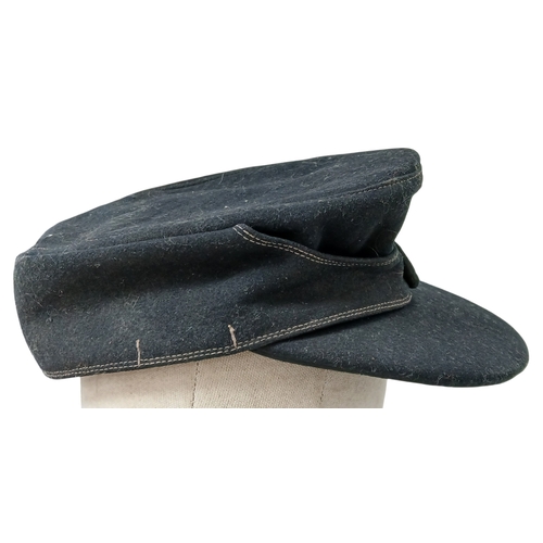 1206 - A WW2 German M43 Panzer Cap. Dated 1944. Size 58.