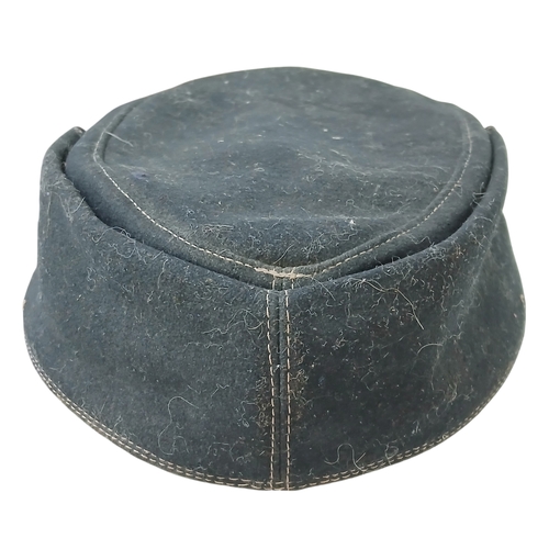 1206 - A WW2 German M43 Panzer Cap. Dated 1944. Size 58.