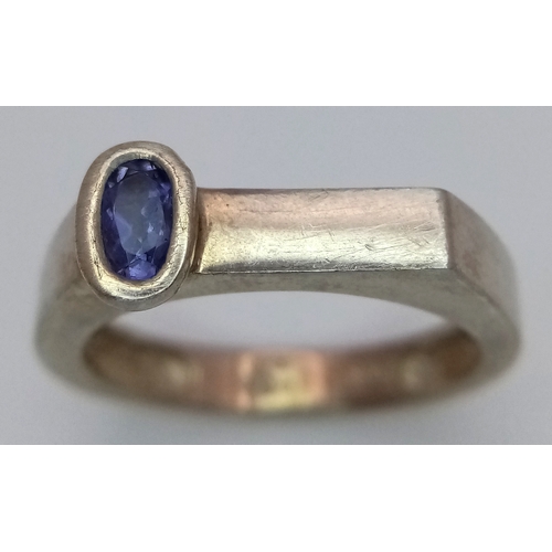 1217 - Sterling Silver Modernist Design Tanzanite Set Ring Size O. A Unique Design Ring Set with a 6mm Long... 