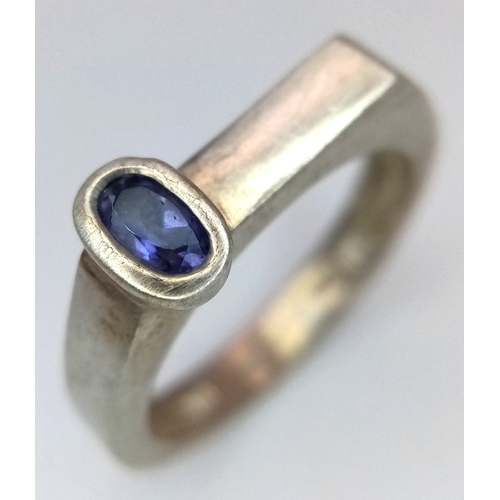 1217 - Sterling Silver Modernist Design Tanzanite Set Ring Size O. A Unique Design Ring Set with a 6mm Long... 