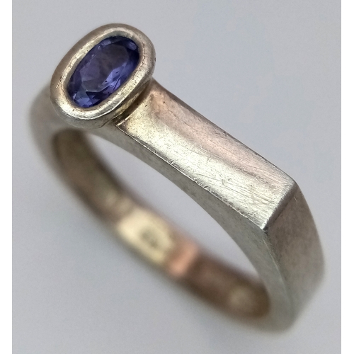 1217 - Sterling Silver Modernist Design Tanzanite Set Ring Size O. A Unique Design Ring Set with a 6mm Long... 