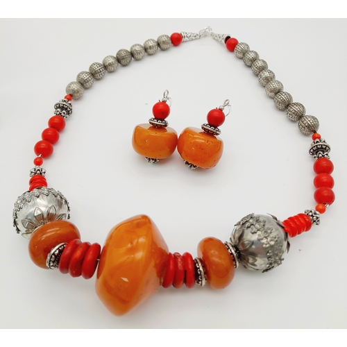 1565 - A graduated resin and coral Berber suite featuring a necklace with silver-toned metal beads, coral a... 