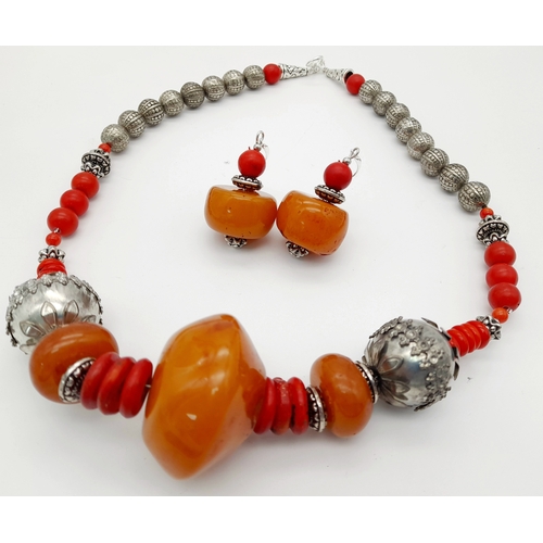 1565 - A graduated resin and coral Berber suite featuring a necklace with silver-toned metal beads, coral a... 