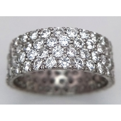 515 - A WGI Certified 14K White Gold (tested) Diamond Eternity Ring. Four rows set with 112 brilliant roun... 