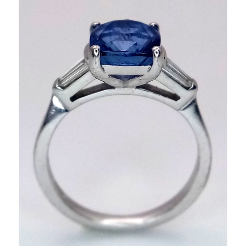 522 - A WGI Certified 18K White Gold, Sapphire and Diamond Ring. A 2ct cushion cut central sapphire with 0... 