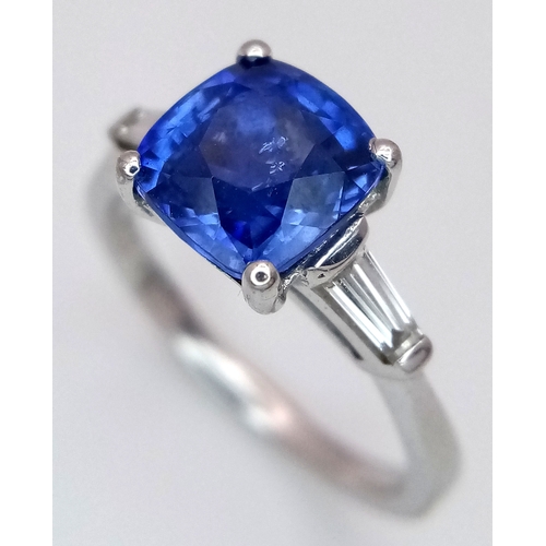 522 - A WGI Certified 18K White Gold, Sapphire and Diamond Ring. A 2ct cushion cut central sapphire with 0... 