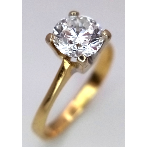 65 - A WGI Certified 18K Yellow Gold and Diamond Solitaire Ring. A 1.02ct brilliant round cut diamond. SI... 