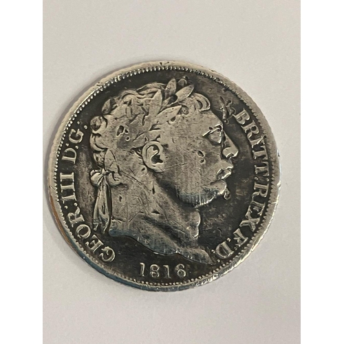 567 - 1816 GEORGE III SILVER BULLHEAD SIXPENCE. Very fine condition, but dirty. Could use a gentle clean.