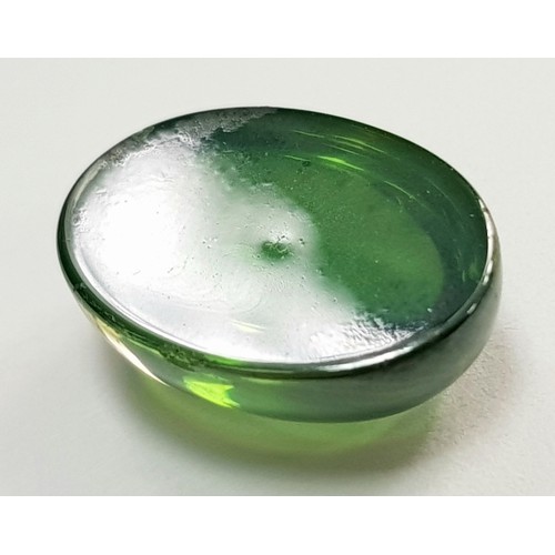 174 - An extremely rare, six-ray, GREEN STAR SAPPHIRE! The oval cabochon has a weight of 9.20 carats and d... 