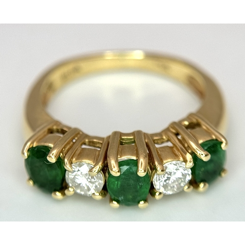 121 - A Mesmerising 14K Yellow Gold Emerald and Diamond Ring. 0.75ctw of oval cut emeralds alternate with ... 