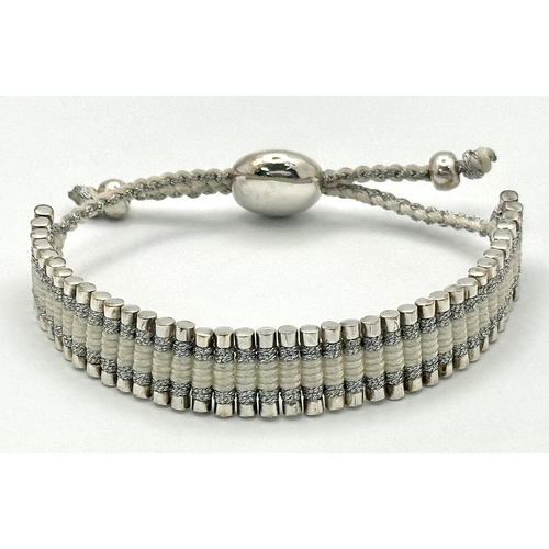 1281 - A Vintage Links of London 925 Silver and Rope Twist Bracelet. Adjustable. Comes with original pouch.