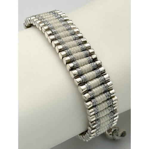 1281 - A Vintage Links of London 925 Silver and Rope Twist Bracelet. Adjustable. Comes with original pouch.