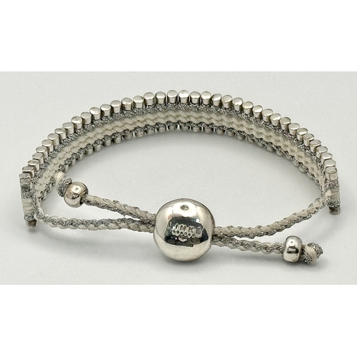 1281 - A Vintage Links of London 925 Silver and Rope Twist Bracelet. Adjustable. Comes with original pouch.