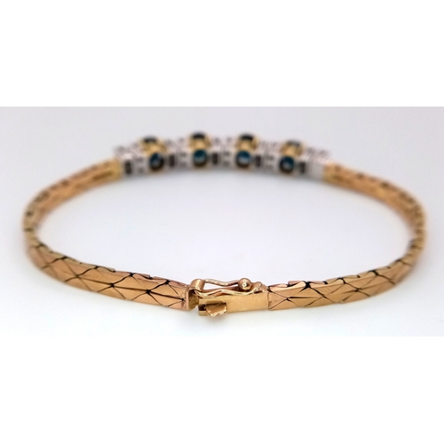 169 - A 9k yellow Gold Diamond and Sapphire Bracelet. 1.2ctw of oval cut sapphires between 0.70ctw of bril... 