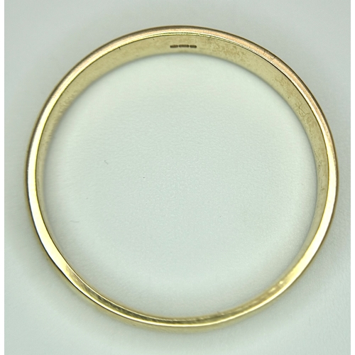 17 - A 9K Yellow Gold Very Large Band Ring. Full UK hallmarks. 4mm width. Size Z+2. 3.9g