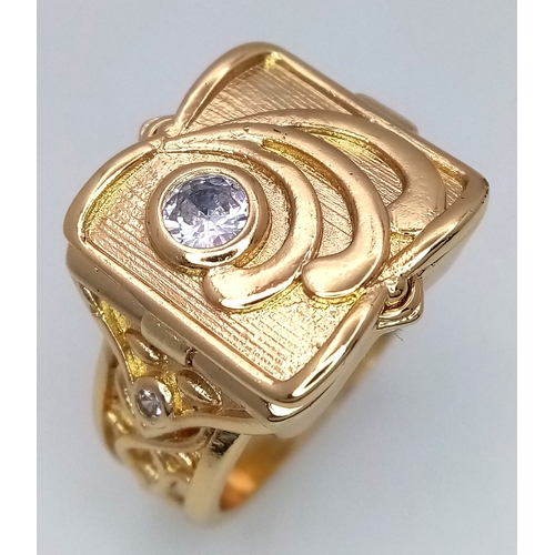 174 - An interesting gold-filled gent’s ring with a single cubic zirconium and a secret compartment for th... 