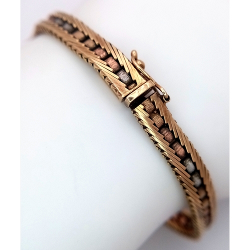 183 - A 9K Yellow Tri-Colour Gold Bracelet. White, yellow and rose gold in a graduated form. 19cm. 18g