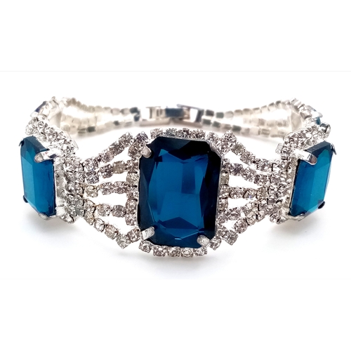 195 - A glamorous dress bracelet with cubic zirconia and synthetic tanzanite, in a presentation box. One s... 