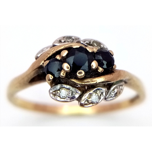 26 - A Vintage 9K Yellow Gold Diamond and Sapphire Crossover Ring. Size N 1/2. 2g.