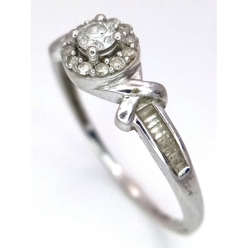 29 - A 10K White Gold Diamond Ring. 0.33ctw of round and baguette cut diamonds. Comes with certificates. ... 