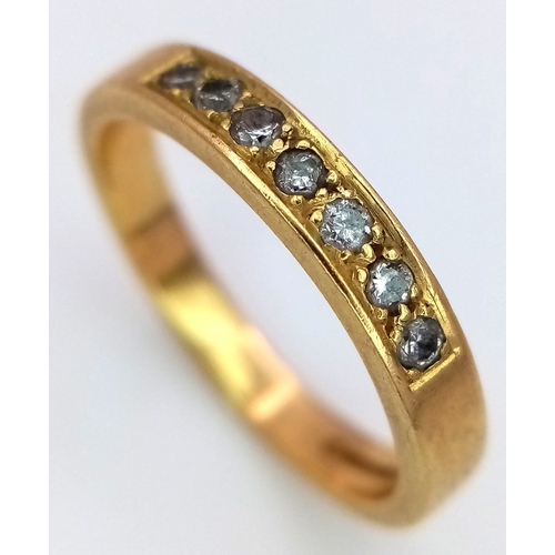 31 - An 18K Yellow Gold Seven Stone Channel Set Diamond Ring. 
Size K. 3.1g