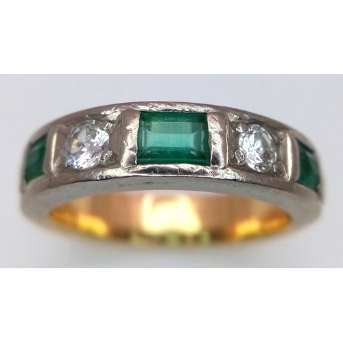 57 - An 18K Yellow Gold (tested) Diamond and Emerald Band Ring. 0.60ctw of brilliant round cut diamonds a... 