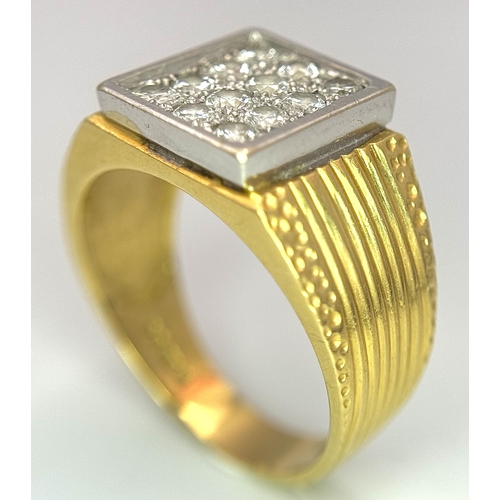 68 - An 18K Yellow Gold Twelve Diamond Signet Dress Ring. Beautifully constructed with ridge and dimple e... 