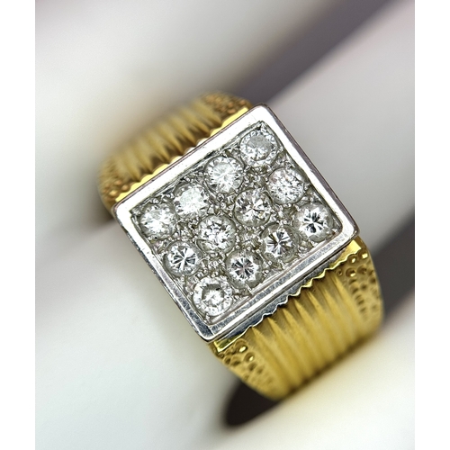 68 - An 18K Yellow Gold Twelve Diamond Signet Dress Ring. Beautifully constructed with ridge and dimple e... 