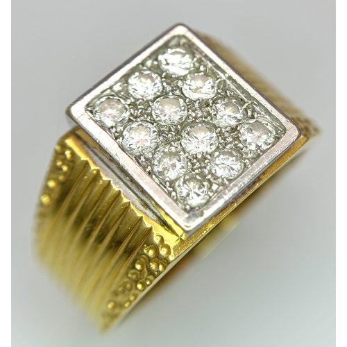 68 - An 18K Yellow Gold Twelve Diamond Signet Dress Ring. Beautifully constructed with ridge and dimple e... 