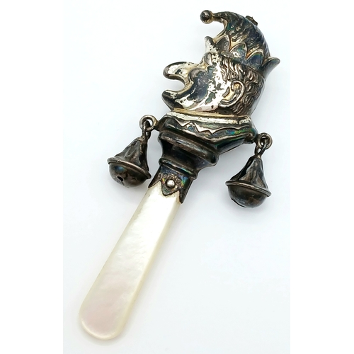 882 - A Vintage Silver Mr Punch Baby Rattle with Mother of Pearl Handle. Hallmarks for Birmingham, 1941. 7... 