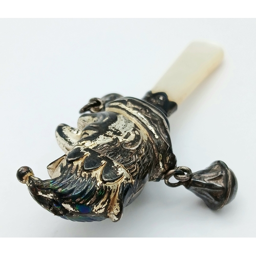 882 - A Vintage Silver Mr Punch Baby Rattle with Mother of Pearl Handle. Hallmarks for Birmingham, 1941. 7... 