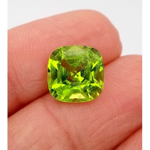 1209 - A 4.81ct Natural Pakistan Peridot Gemstone, Brilliant Cut, 10.00 x 9.92 x 6.82mm. Comes with a GFCO ... 