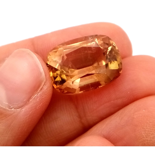 1328 - A 19.32ct Imperial Topaz Gemstone. Cushion shape. GFCO Swiss Certified.